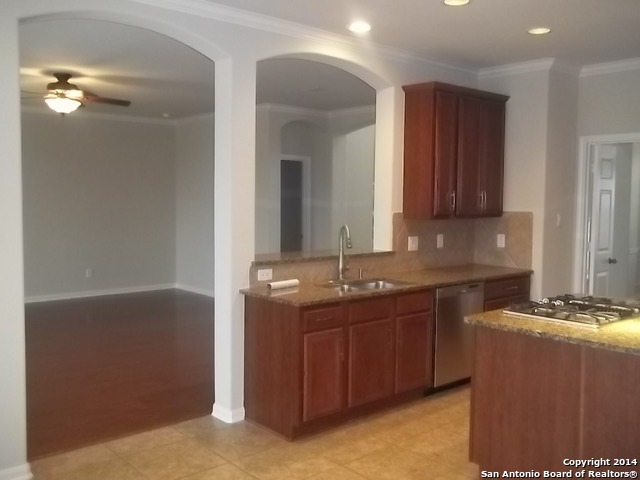 16202 Juan Tabo Way Helotes, TX 78023 - Photo 8 of 22 a kitchen with a sink and cabinets