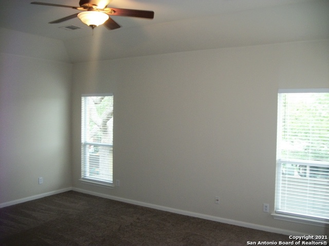 16202 Juan Tabo Way Helotes, TX 78023 - Photo 9 of 22 an empty room with a window