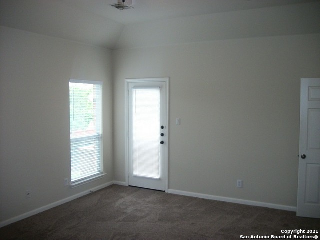 16202 Juan Tabo Way Helotes, TX 78023 - Photo 10 of 22 an empty room with windows