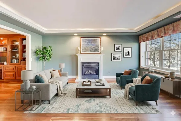 a living room with hardwood floor and furniture
