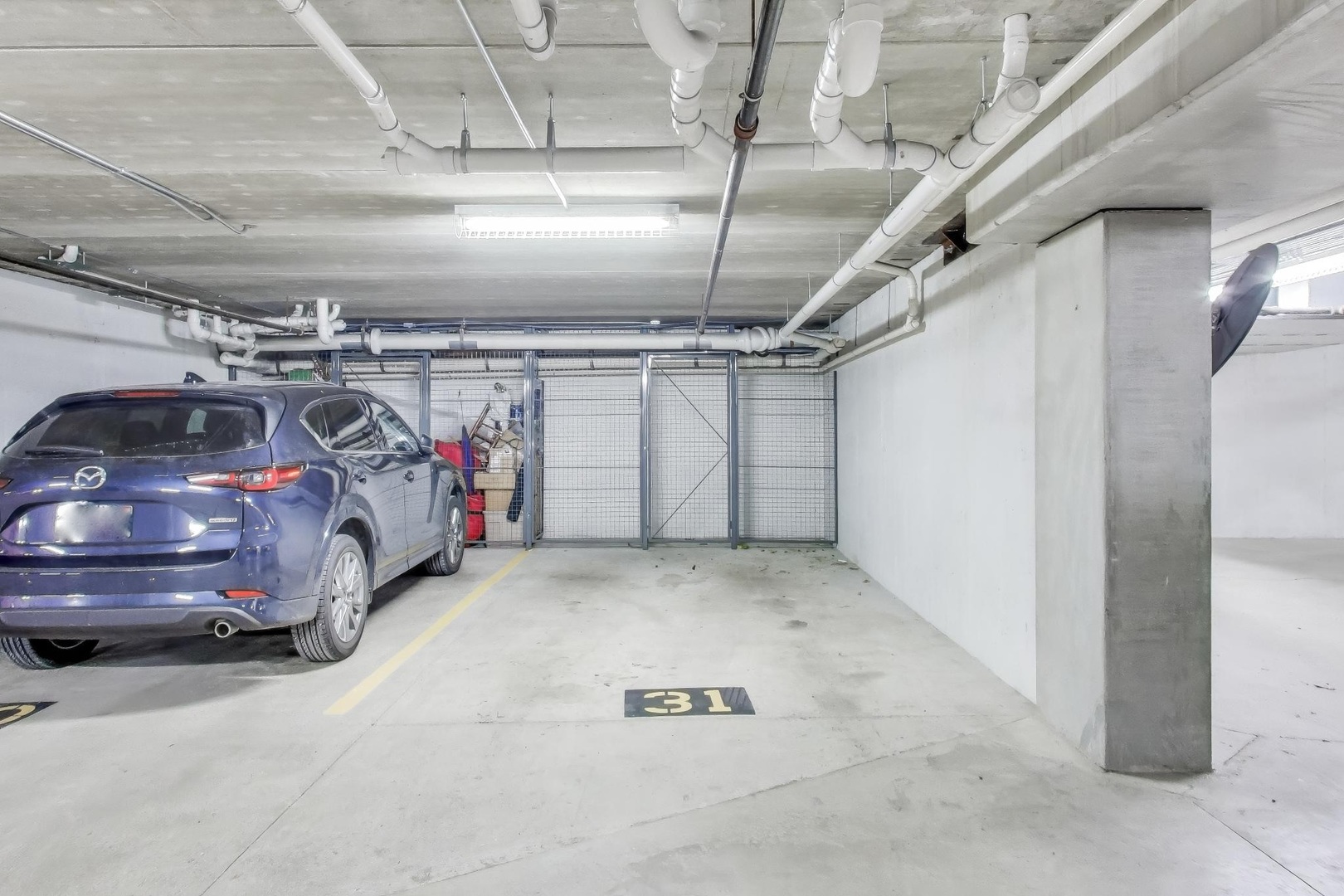 10 East Burlington Street, Unit 2C Riverside, IL 60546 - Photo 26 of 46 a view of parking garage with cars
