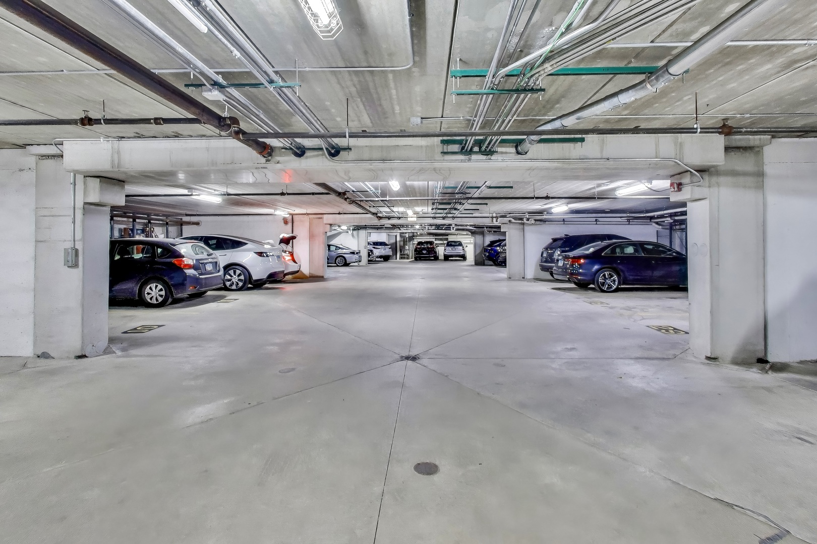 10 East Burlington Street, Unit 2C Riverside, IL 60546 - Photo 27 of 46 a view of parking garage with cars