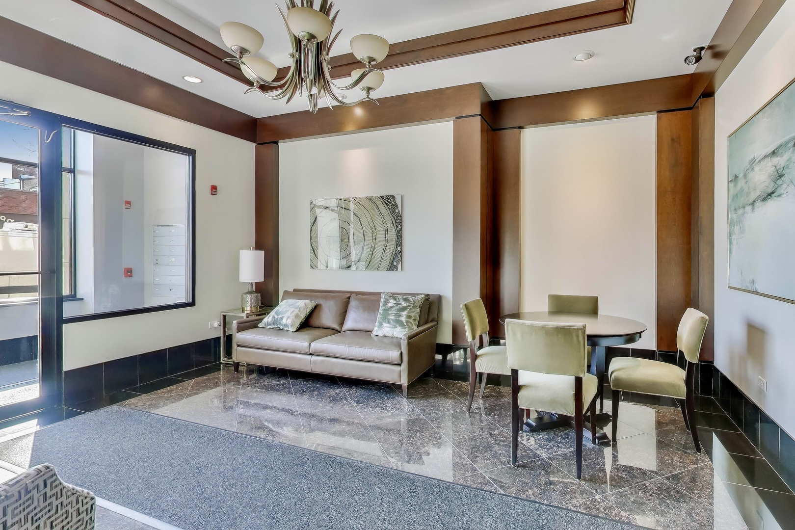 10 East Burlington Street, Unit 2C Riverside, IL 60546 - Photo 3 of 46 a living room with furniture and a large window