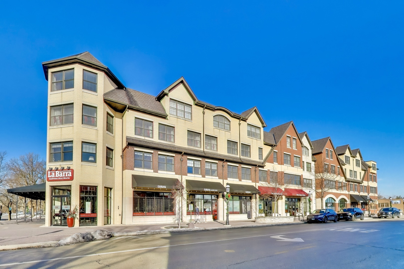 10 East Burlington Street, Unit 2C Riverside, IL 60546 - Photo 37 of 46 a front view of a building with lot of cars and trees