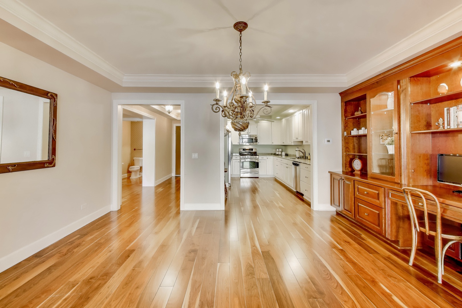 10 East Burlington Street, Unit 2C Riverside, IL 60546 - Photo 7 of 53 a view of a room with wooden floor and large windows