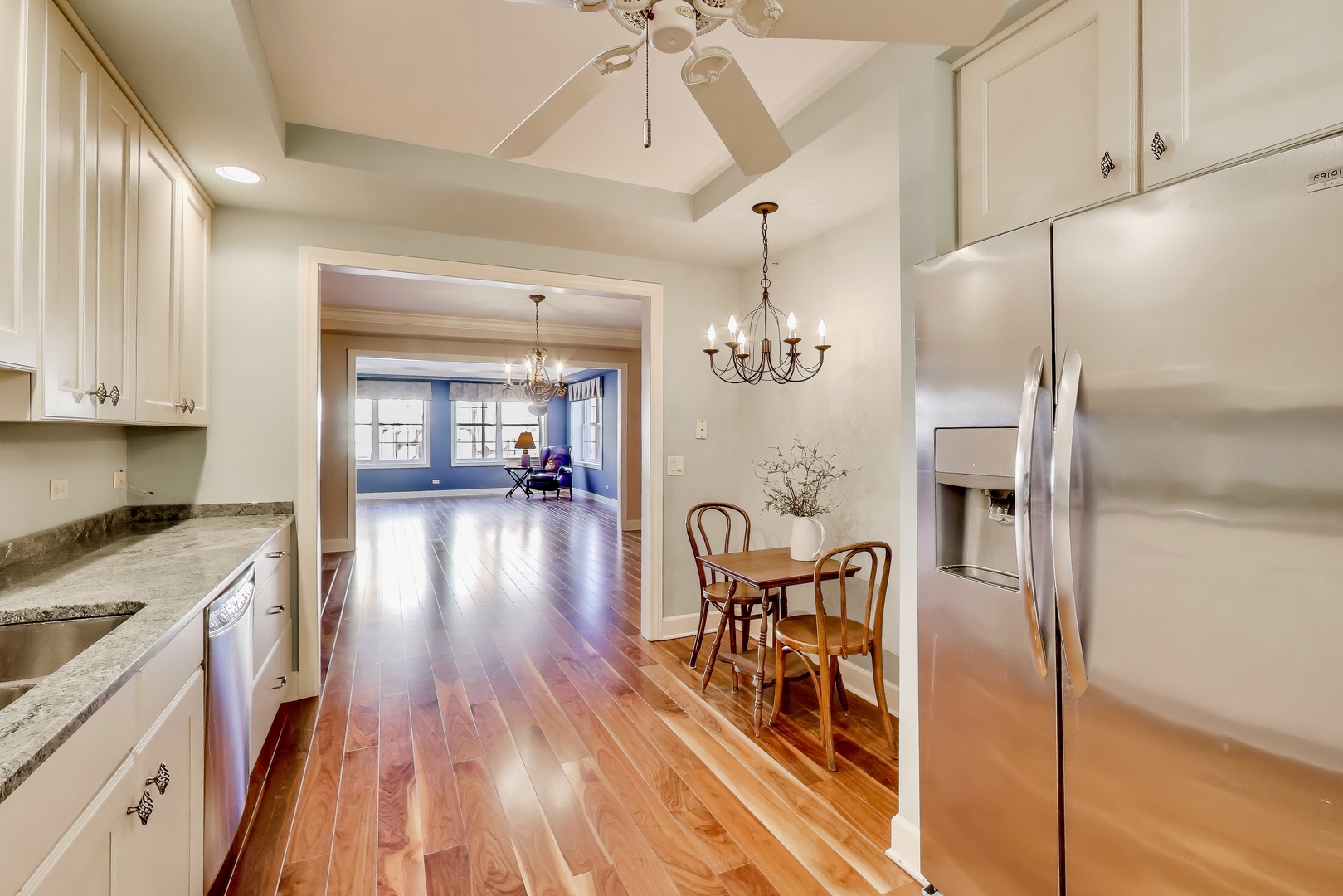 10 East Burlington Street, Unit 2C Riverside, IL 60546 - Photo 10 of 53 a open kitchen with stainless steel appliances granite countertop a refrigerator a stove and a wooden floors