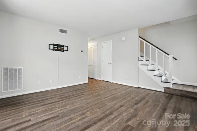 a view of an entryway with wooden floor