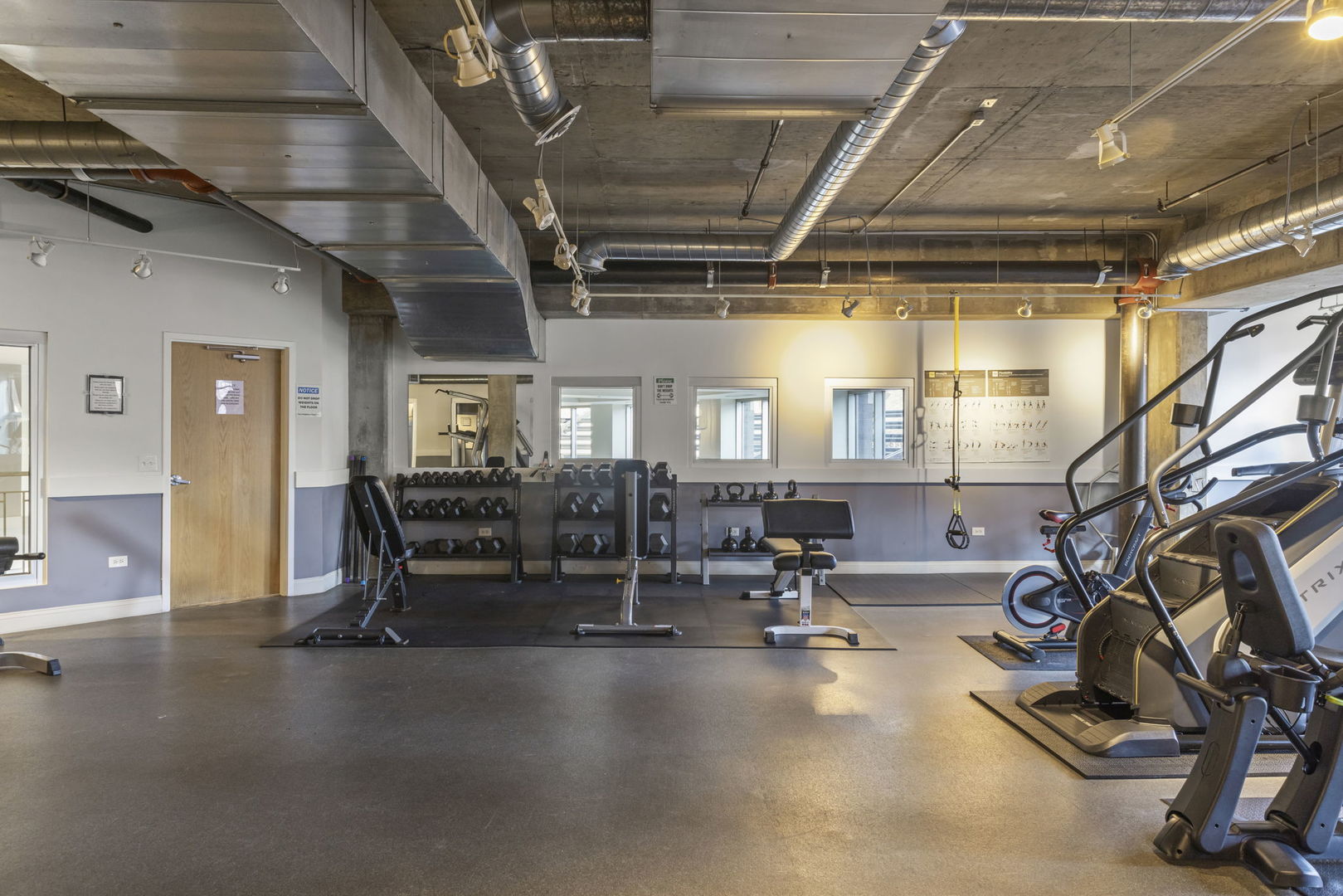 1000 West Adams Street, Unit 302 Chicago, IL 60607 - Photo 15 of 19 a view of a room with gym equipment