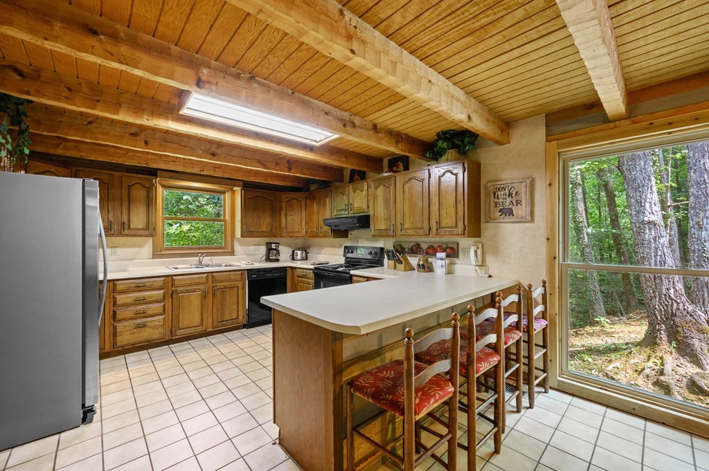 4296 Powdermill Estates Road Sevierville, TN 37876 - Photo 21 of 55 a large white kitchen with a large window