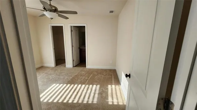 a view of a hallway view with staircase