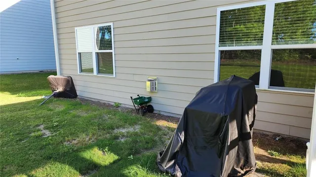 a view of a backyard with sitting area