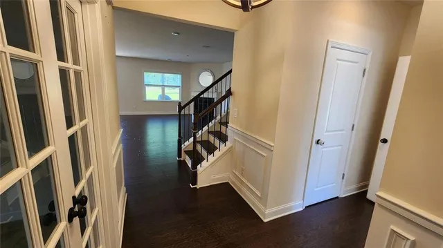 a view of entryway with stairs and wooden floor