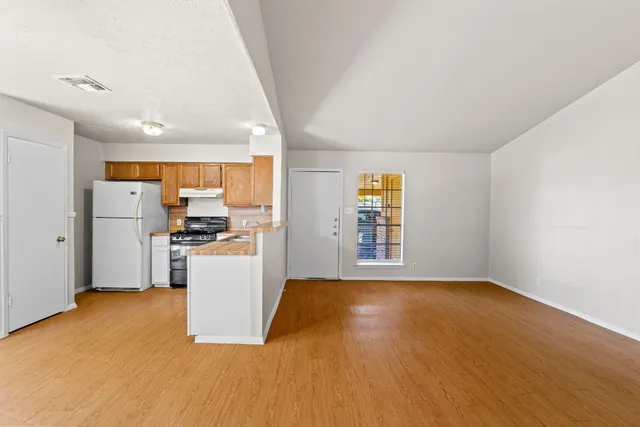 a view of kitchen with wooden floor