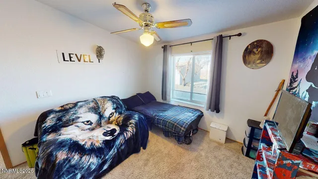 a bathroom with a sink a toilet a mirror and shower