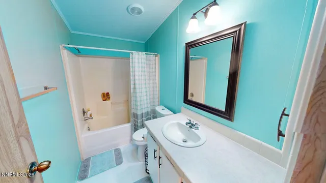 a bed room with a bed and a chandelier