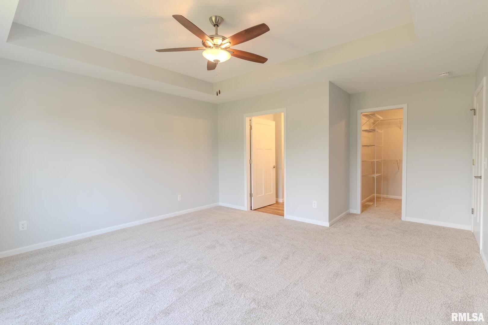 941 9th Avenue North Clinton, IA 52732 - Photo 15 of 24 an empty room with chandelier fan and windows