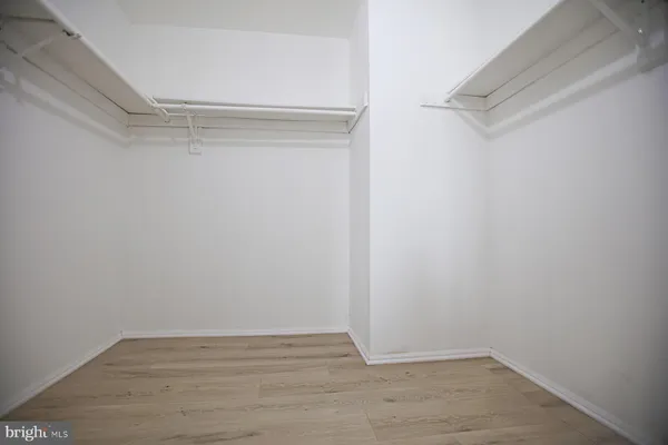 a view of an empty walk in closet