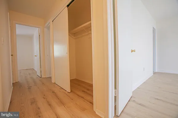 a view of a bathroom with wooden floor