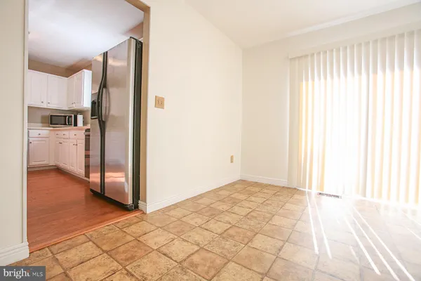 a view of a kitchen with a refrigerator