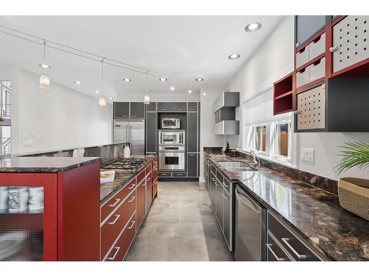 821 Incorrigible Circle Longmont, CO 80504 - Photo 13 of 43 a kitchen with stainless steel appliances granite countertop a stove and a sink