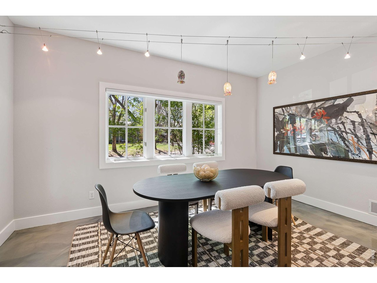 821 Incorrigible Circle Longmont, CO 80504 - Photo 15 of 43 a view of a dining room with furniture and a large window