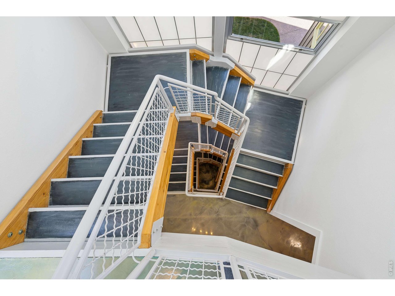 821 Incorrigible Circle Longmont, CO 80504 - Photo 16 of 43 Architectural Stunning Staircase w/ Large Windows