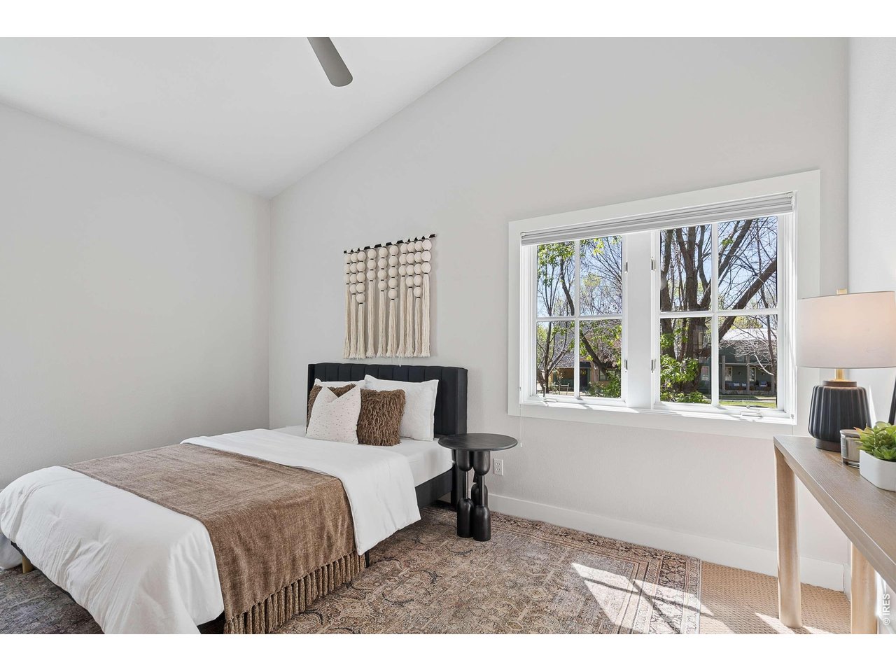 821 Incorrigible Circle Longmont, CO 80504 - Photo 20 of 43 a bedroom with a bed and a window