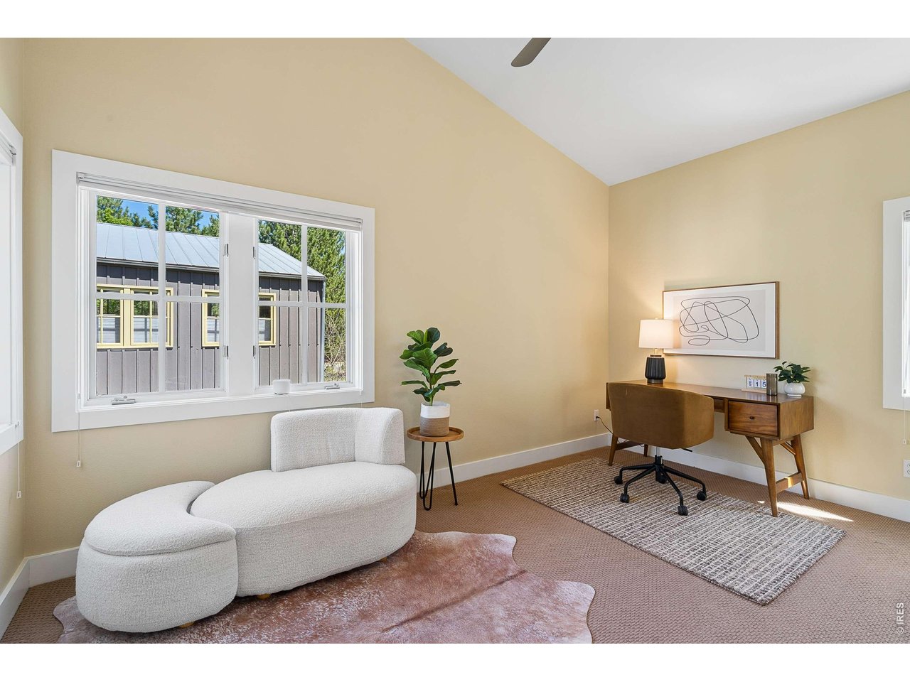 821 Incorrigible Circle Longmont, CO 80504 - Photo 21 of 43 a living room with furniture rug and a window