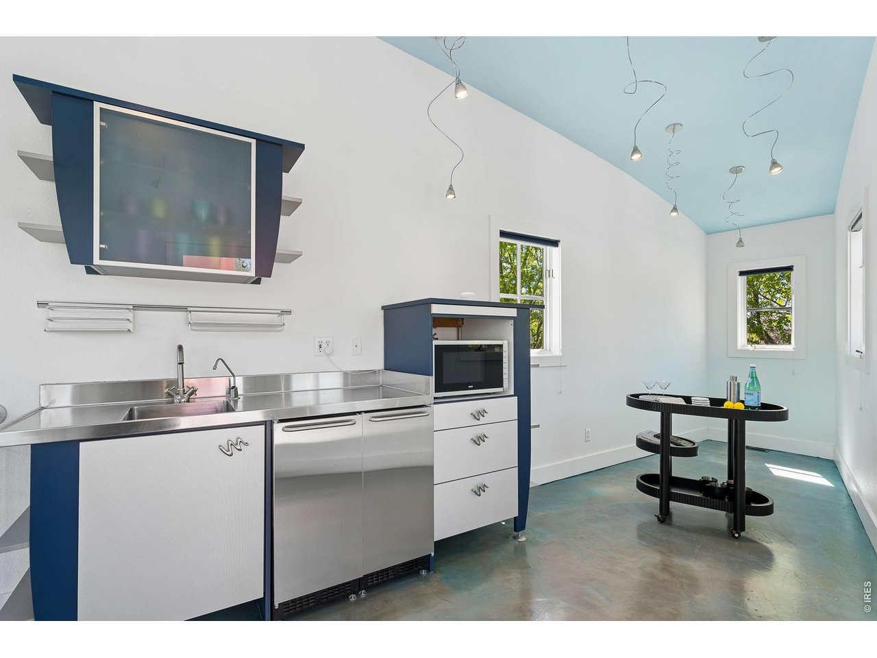 821 Incorrigible Circle Longmont, CO 80504 - Photo 24 of 43 a kitchen with a stove a sink and a microwave
