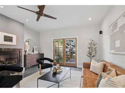 a living room with furniture rug and a window