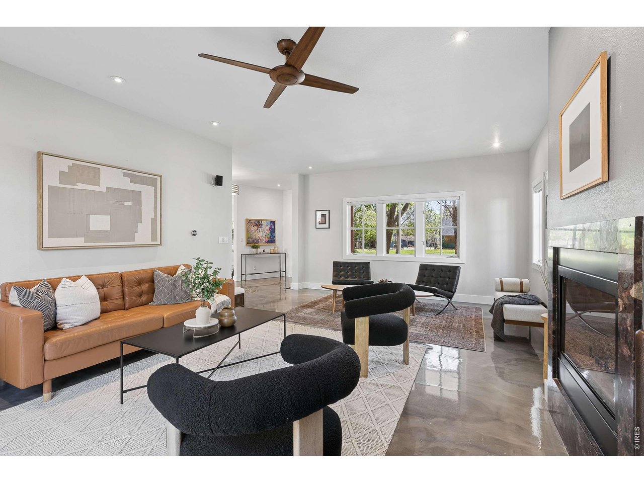 821 Incorrigible Circle Longmont, CO 80504 - Photo 10 of 43 a living room with furniture and a large window