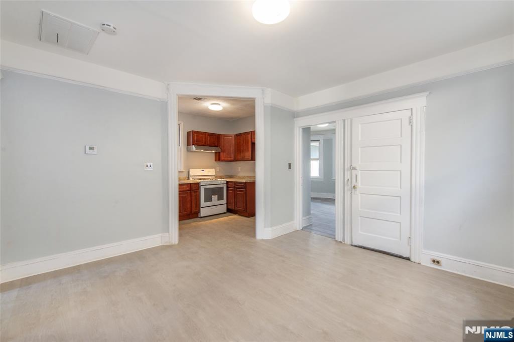 51 Maple Street Garfield, NJ 07026 - Photo 5 of 12 a view of a kitchen with a sink and cabinets