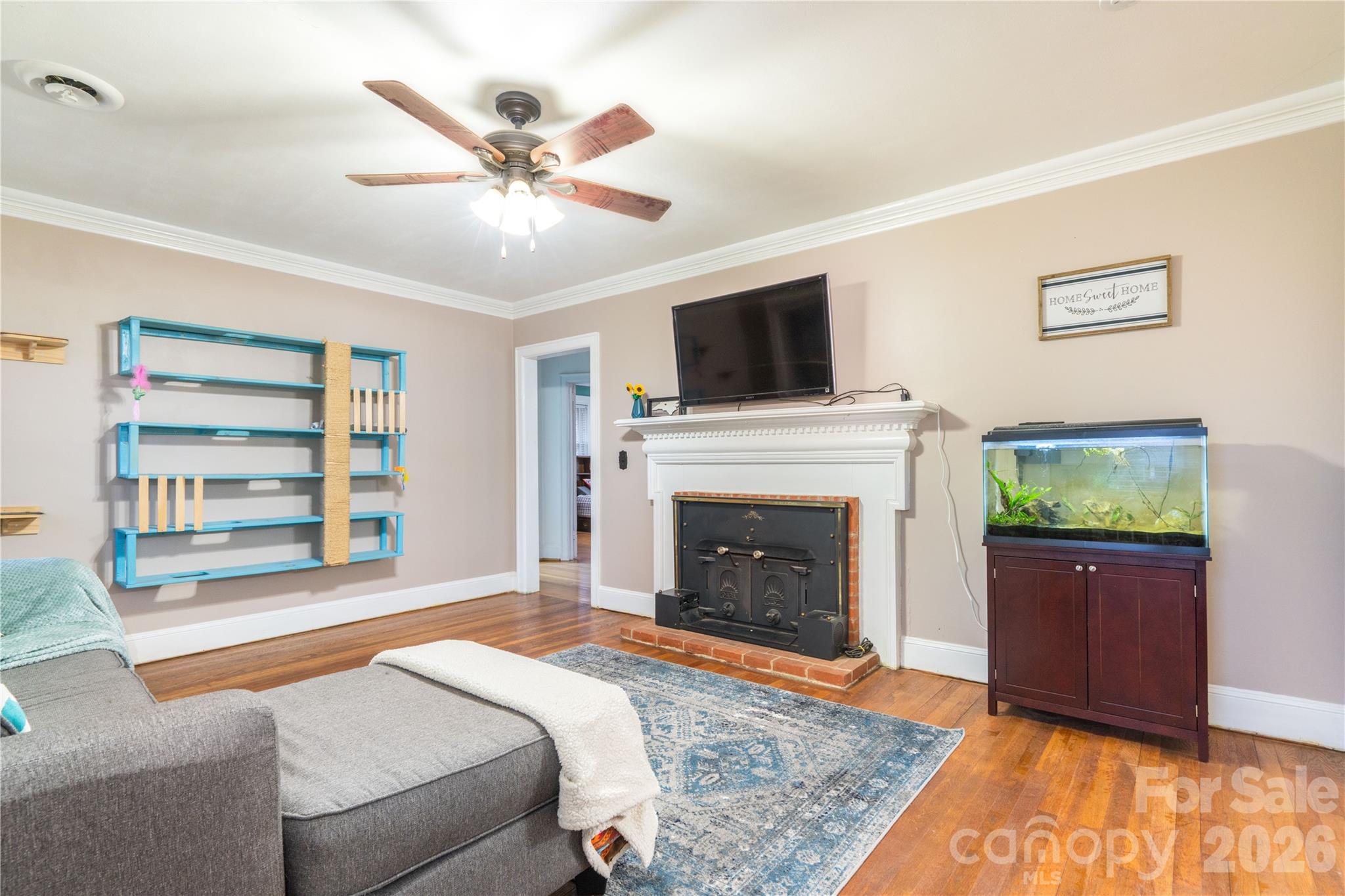 6507 Frieden Church Road Gibsonville, NC 27249 - Photo 25 of 45 a spacious bedroom with a bed and a fireplace