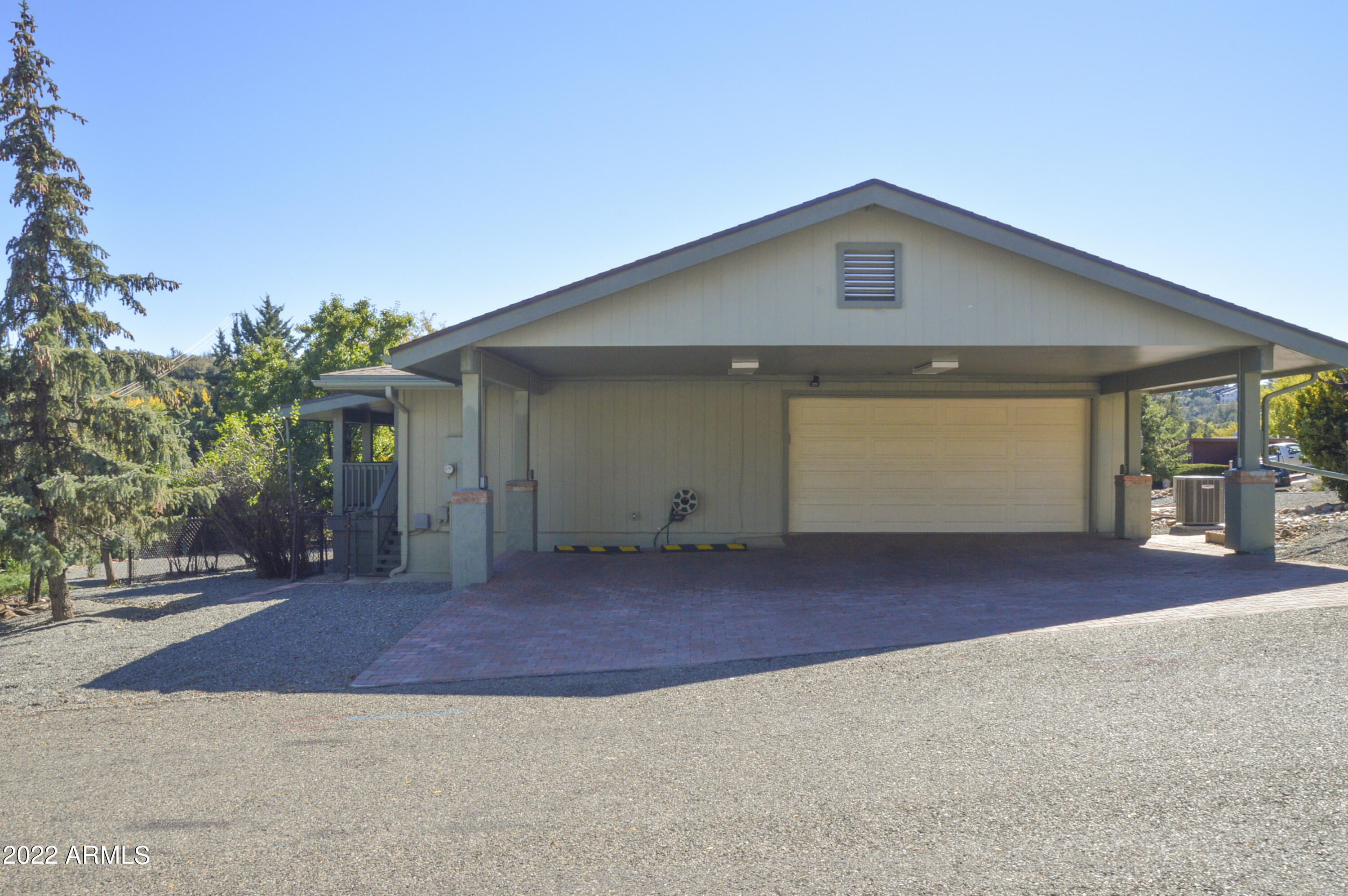 685 Dragonfly Drive Prescott, AZ 86301 - Photo 22 of 24 a front view of a house with a yard and garage