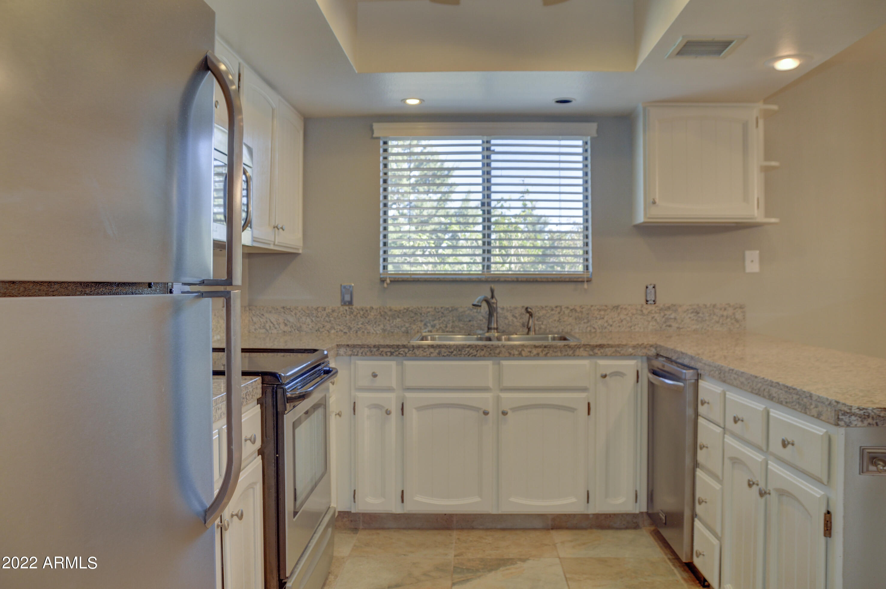 685 Dragonfly Drive Prescott, AZ 86301 - Photo 10 of 24 a kitchen with a sink cabinets and window