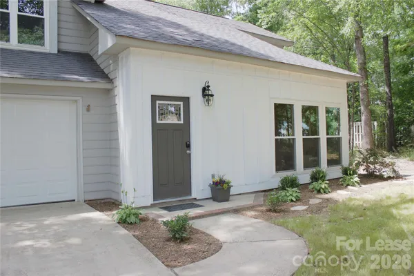 a front view of a house having yard