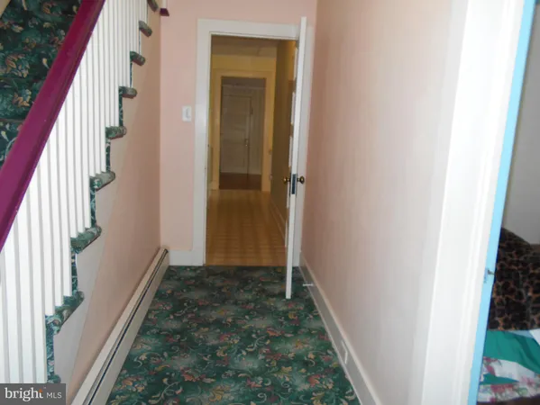 a view of room with window and stairs