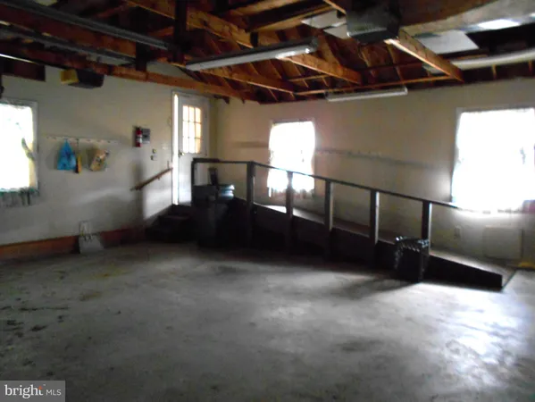a view of an empty room with windows