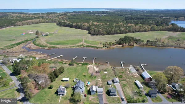 an aerial view of a house with a lake view