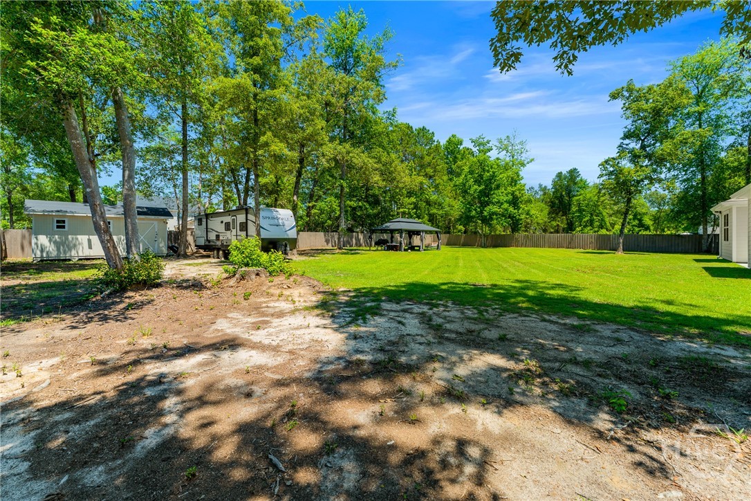 132 Ramsey Way Rincon, GA 31326 - Photo 53 of 59 Shade when you want it. Open air when you don’t. That’s the beauty of it.