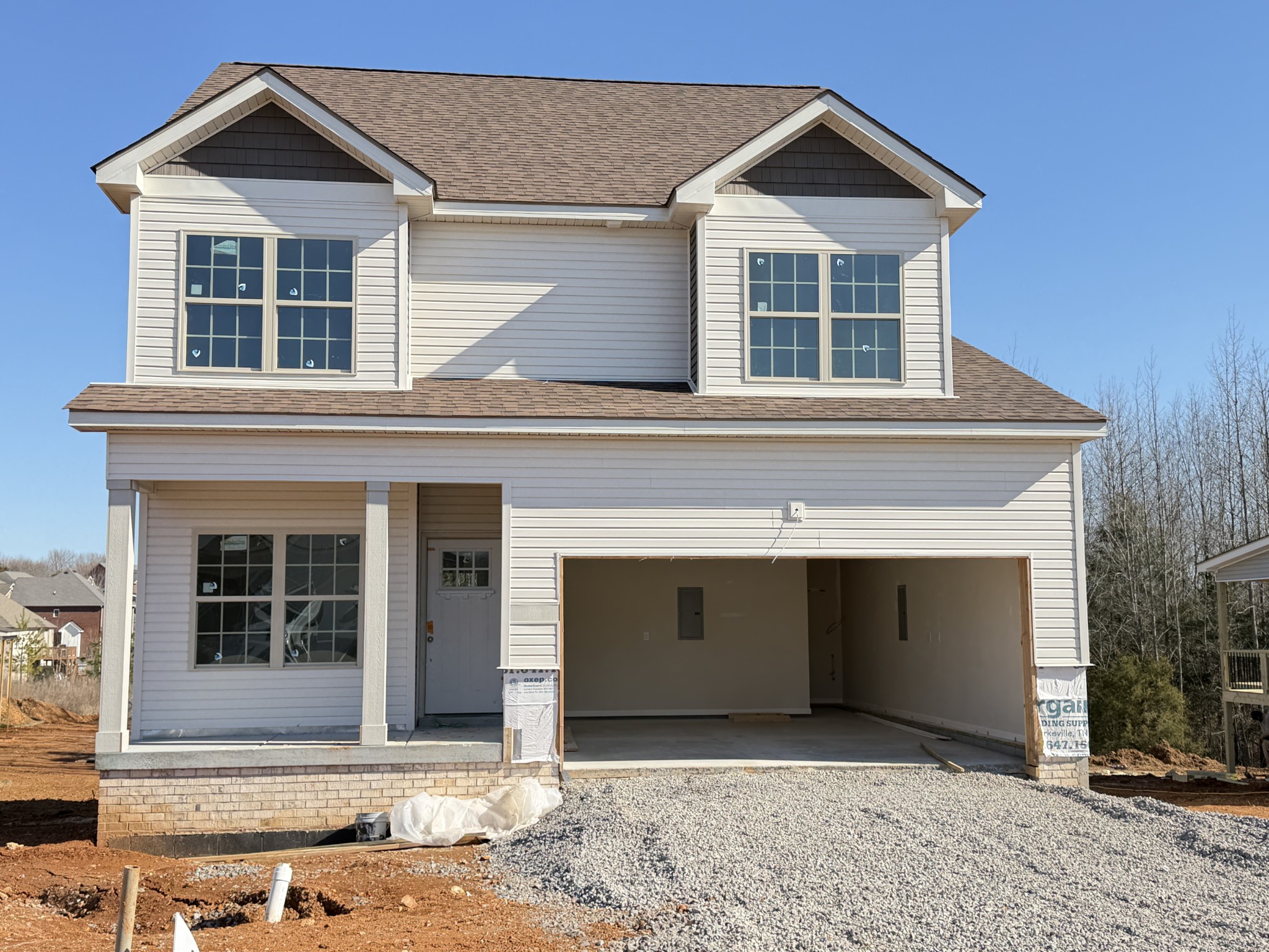 128 Hummingbird Way Clarksville, TN 37043 - Photo 1 of 19 a front view of a house with a yard and garage