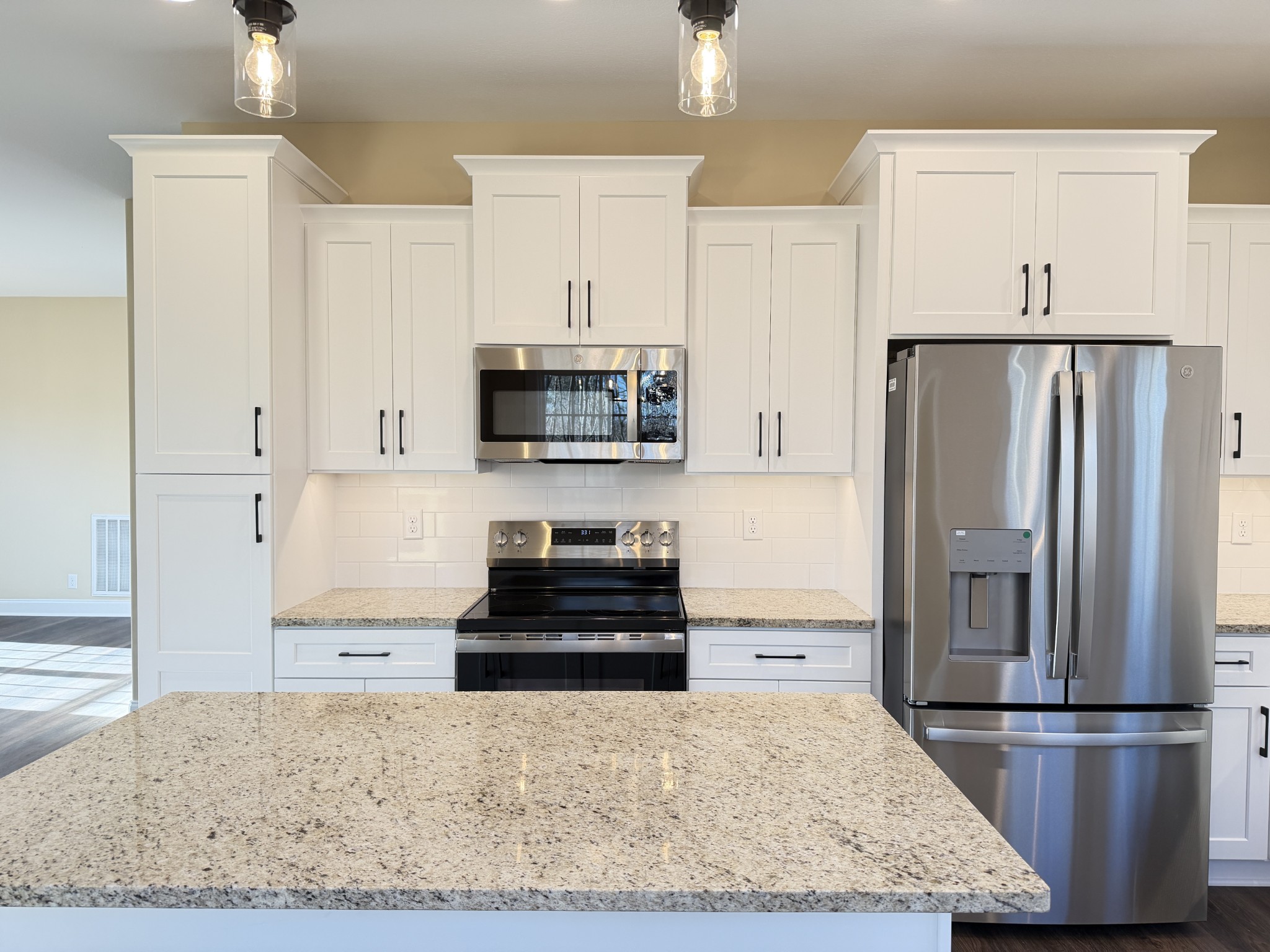 128 Hummingbird Way Clarksville, TN 37043 - Photo 6 of 19 a kitchen with stainless steel appliances granite countertop a refrigerator and a stove top oven