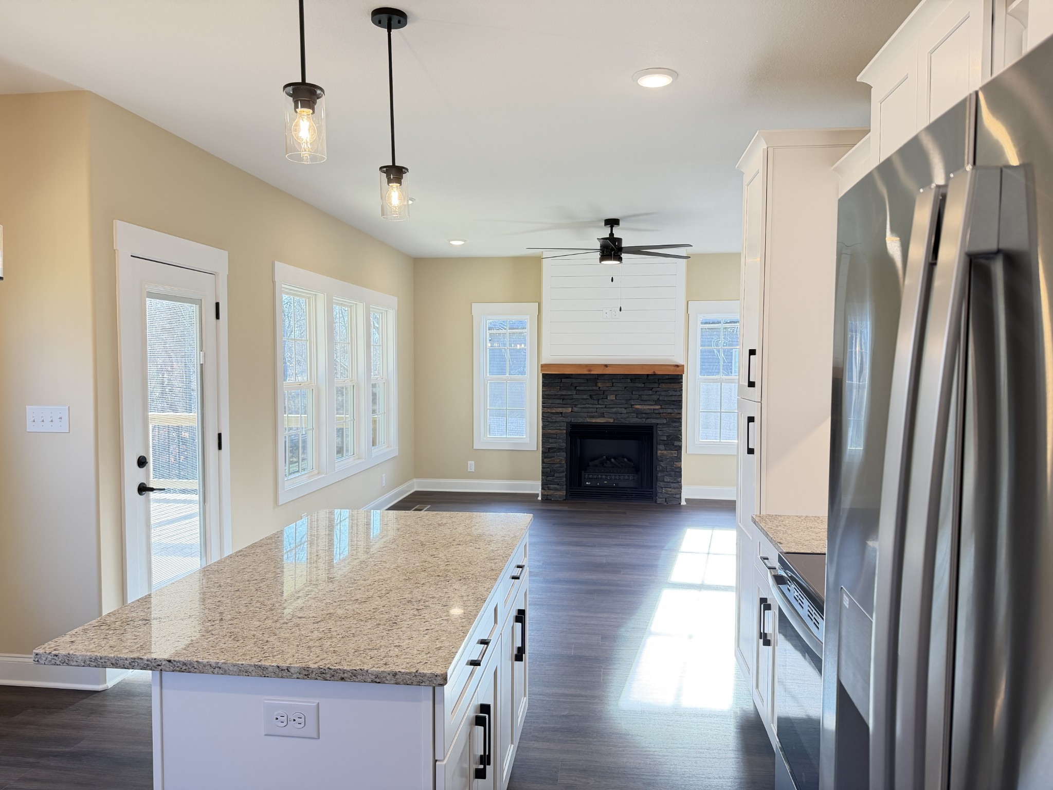 128 Hummingbird Way Clarksville, TN 37043 - Photo 7 of 19 a kitchen with stainless steel appliances granite countertop a refrigerator a oven and a sink with granite countertops
