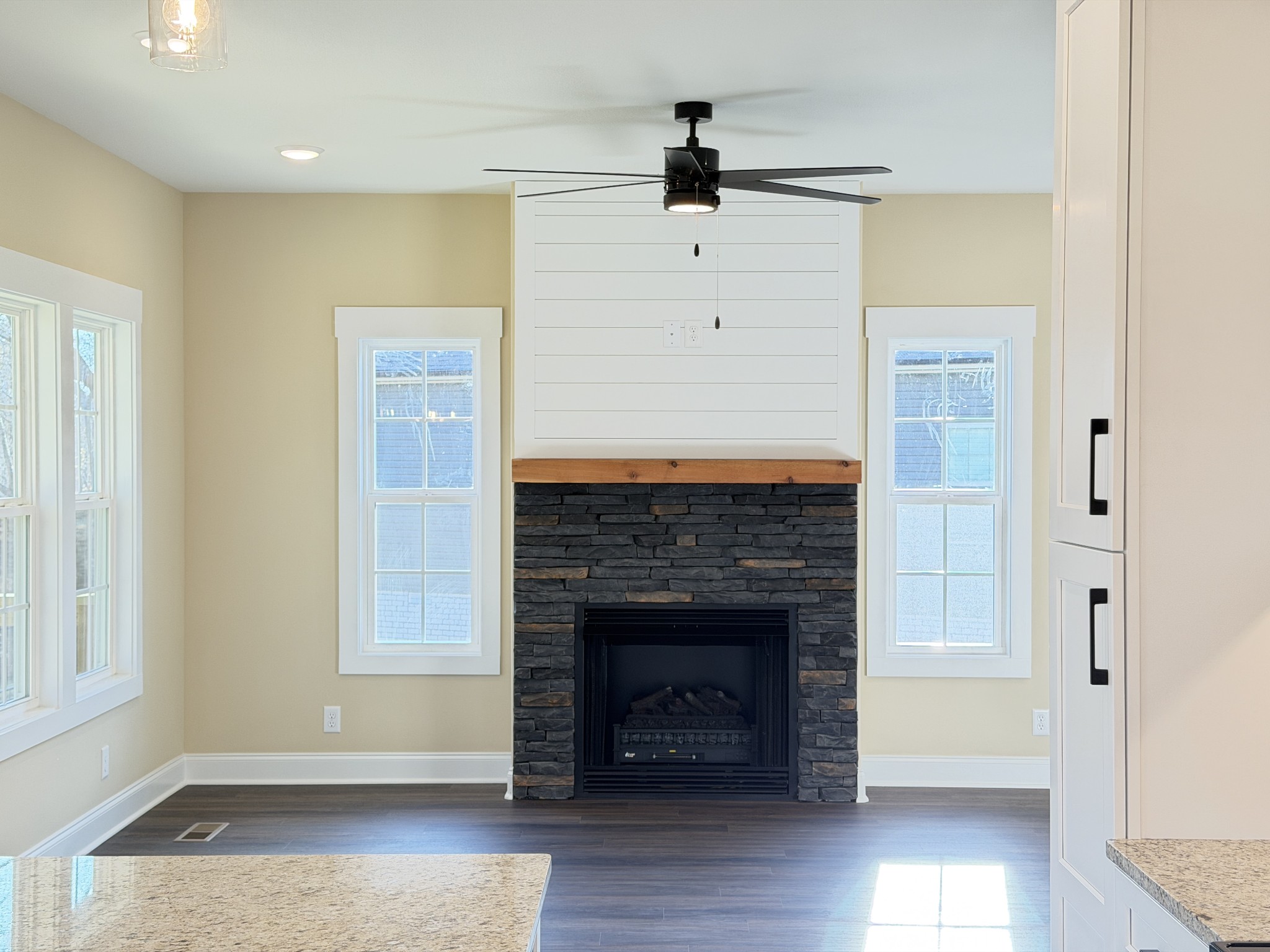 128 Hummingbird Way Clarksville, TN 37043 - Photo 8 of 19 a view of an empty room with wooden floor and a fireplace