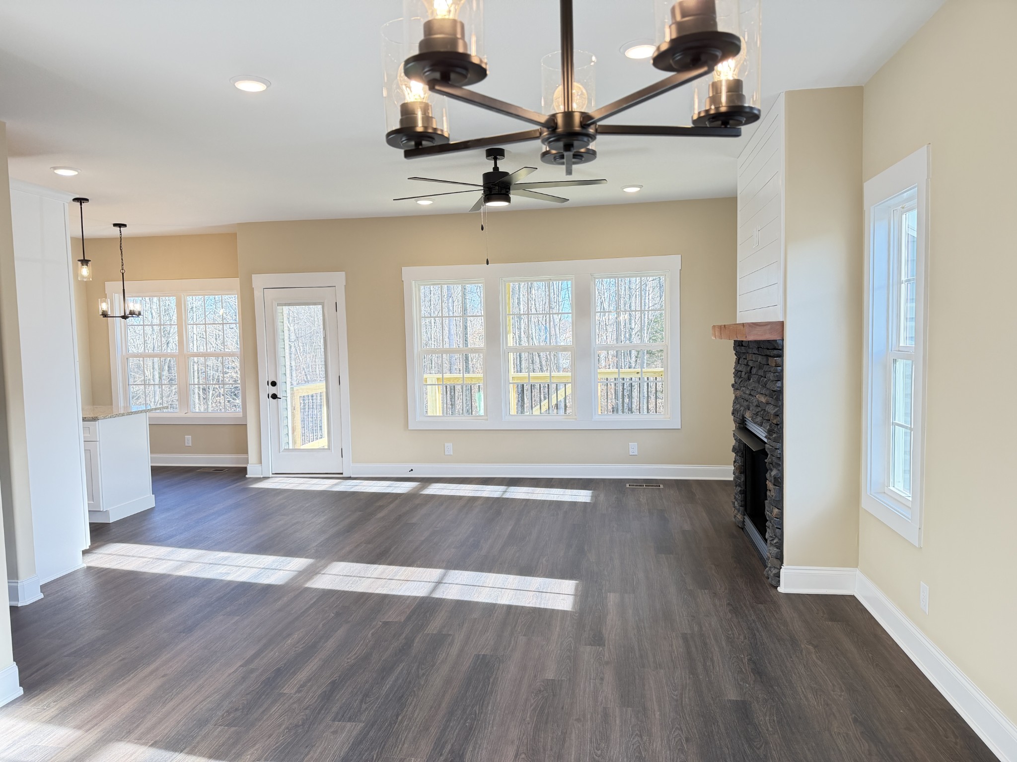 128 Hummingbird Way Clarksville, TN 37043 - Photo 9 of 19 a view of an empty room with wooden floor and a window