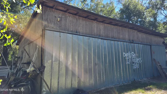 a backyard with a wooden fence