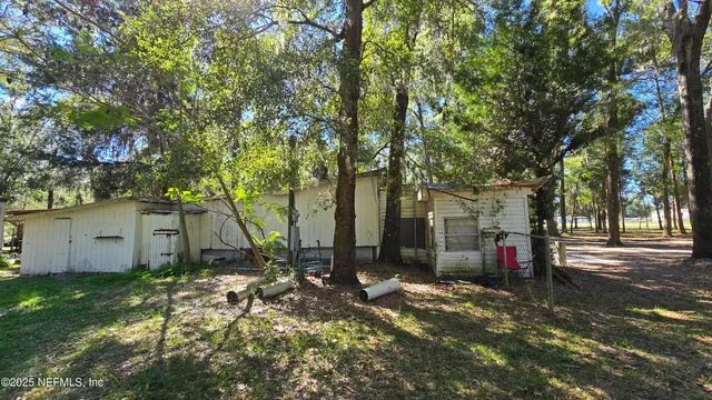 a view of a tree in front of a house