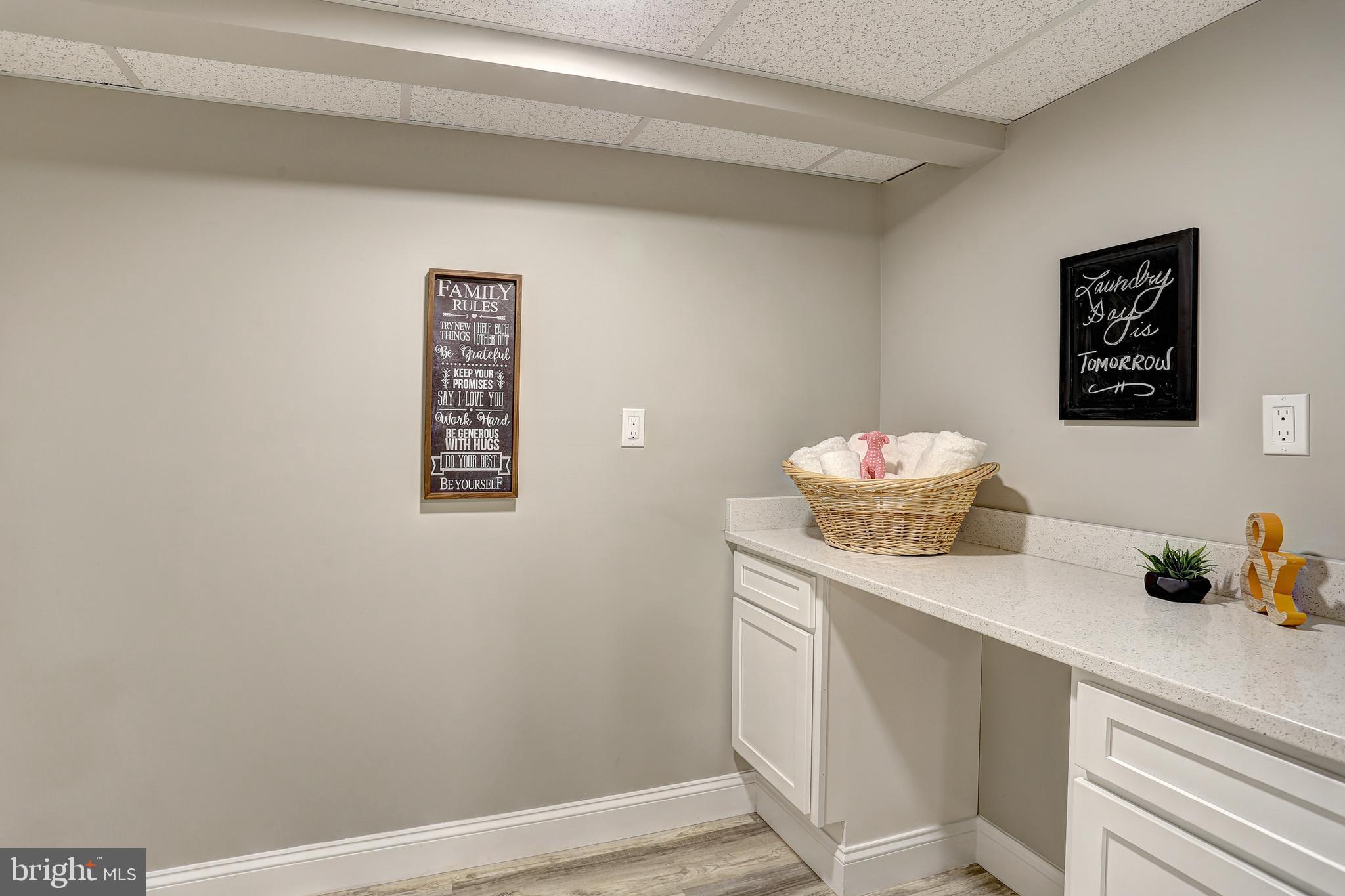 13649 Highland Road Clarksville, MD 21029 - Photo 32 of 56 LAUNDRY RM W/GRANITE COUNTERS & BUILT-IN CABINETS