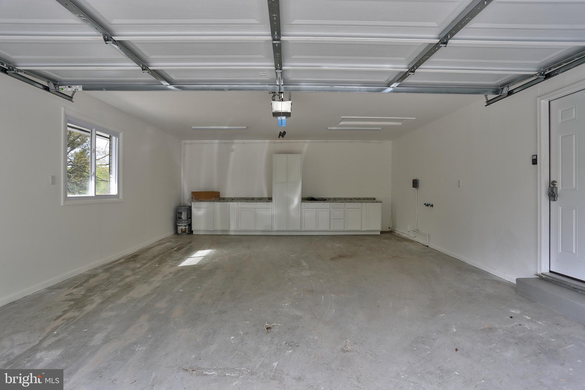 13649 Highland Road Clarksville, MD 21029 - Photo 37 of 56 FINISHED GARAGE WITH NEW BUILT-IN CABINETS & DOOR