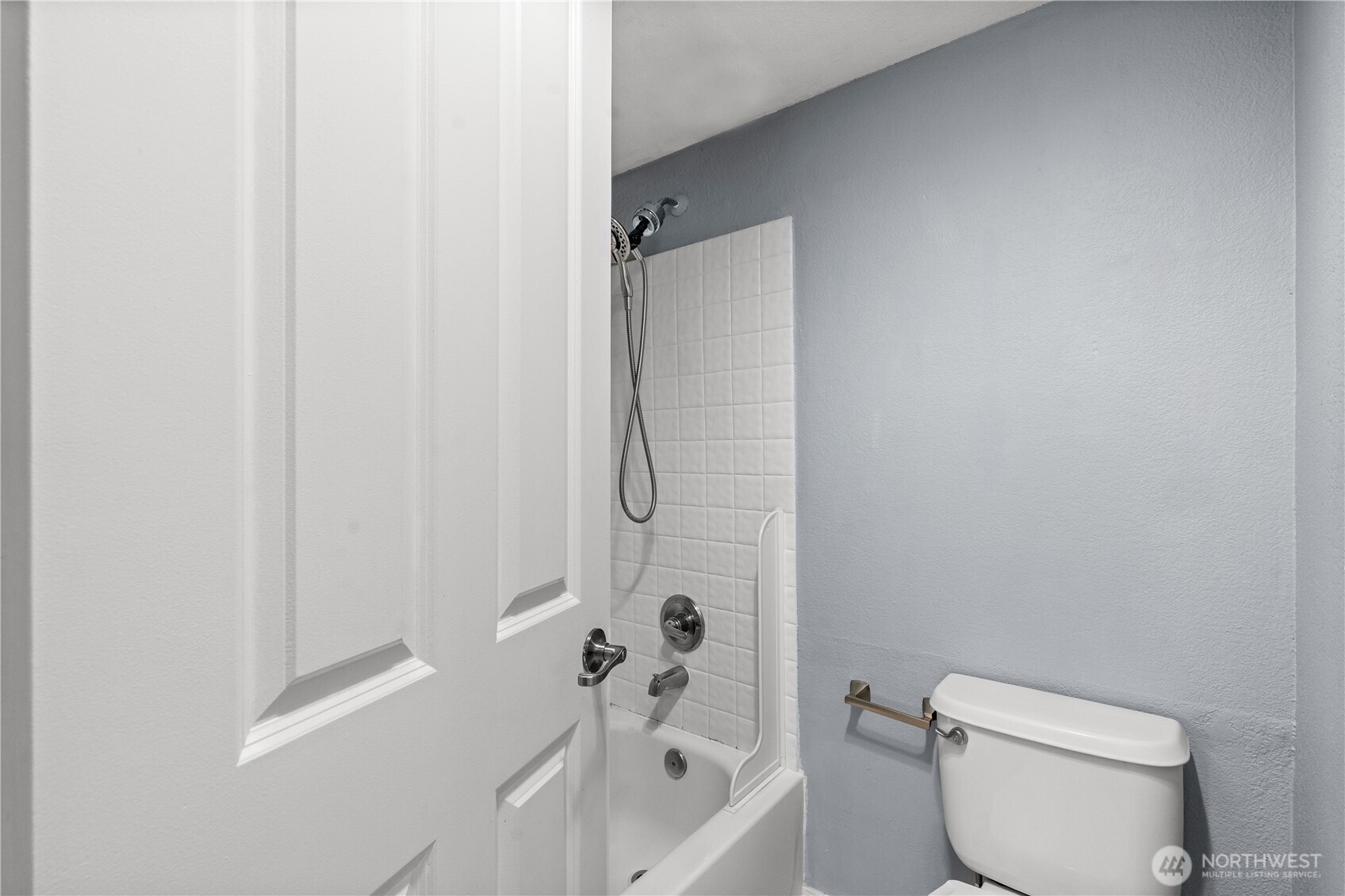 1321 South Puget Drive, Unit E15 Renton, WA 98055 - Photo 25 of 30 a bathroom with a toilet and shower